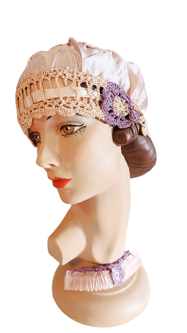 1920s_antique_peach_rayon_and_crochet_trimmed_unworn_bed_boudoir_cap_and_garter_set-removebg-p...png