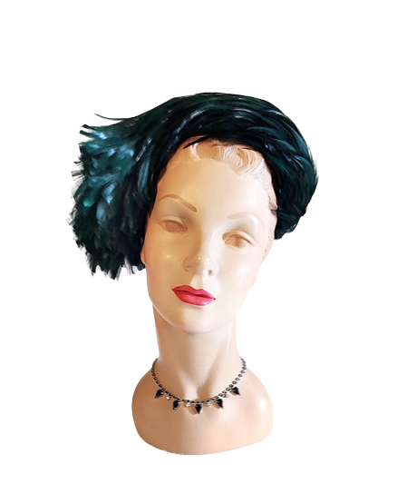 1950s_vintage_green_profile_felt_hat_with_green_feathers-removebg-preview.png