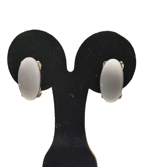 1960s grey oval moon glow lucite clip earrings.png