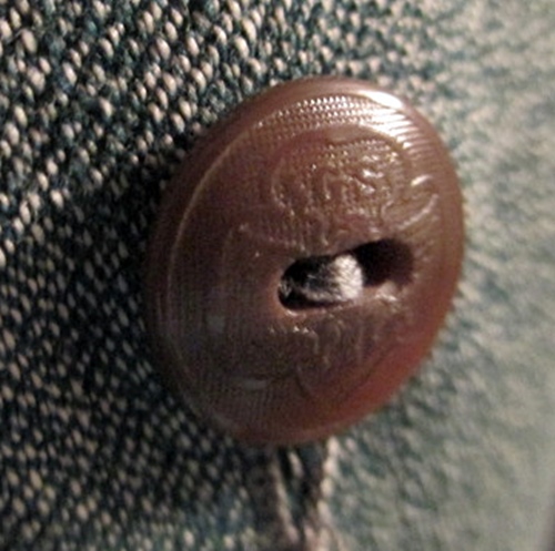 40s girl scouts button on uniform.JPG