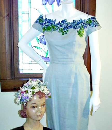 50s blue linin sheath dress with floral necklane.jpg