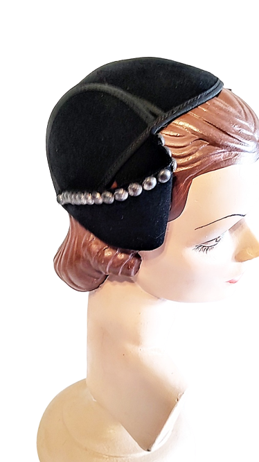 black_felt_1930s_vintage_small_hat_with_side_wings_and_studs-removebg-preview.png