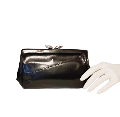 black_leather_small_1930s_vintage_art_deco_clutch_bag_metal_clasp_vintage-removebg-preview.png