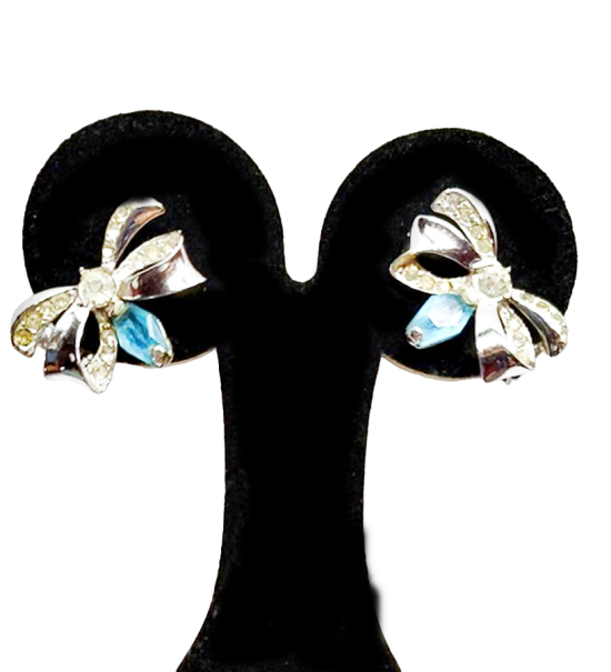 blue clear bow clip 1950s earrings 1.png