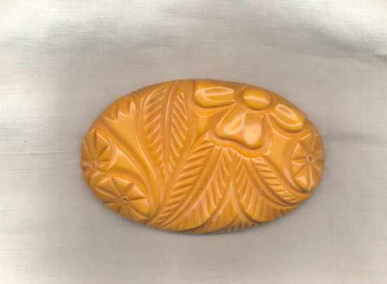 Butterscotch Bakelite Deep Carved Floral Brooch.jpg