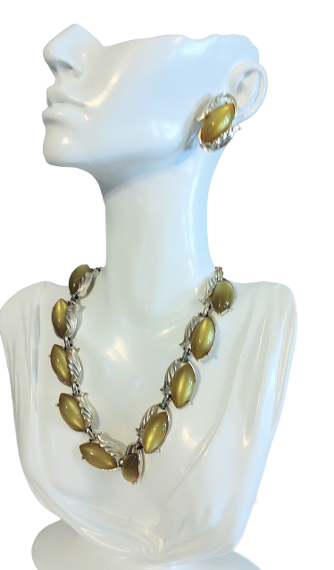 green lucite necklace and earrings moon glow lucite 60s.png