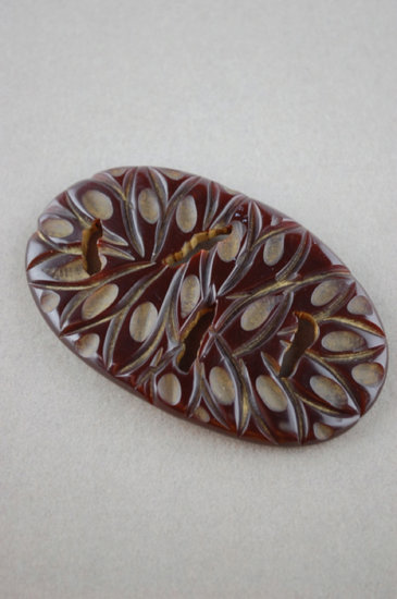 JP53-deeply carved pierced brown Bakelite oval pin - 1.jpg
