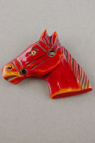 JP54-orangeredcarvedBakelitehorseheadpin-1_zps326907e9.jpg