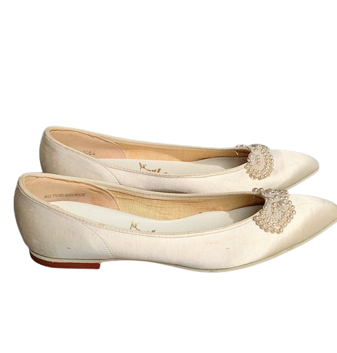 unworn_cream_60s_vintage_flat_shoes_with_pearl_bows-removebg-preview.png